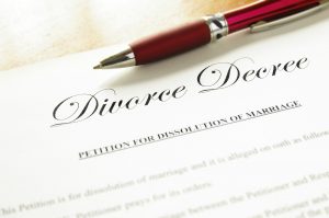 closeup of a divorce decree document with pen