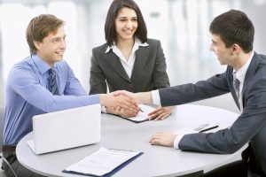 Business people shaking hands, finishing up a meeting